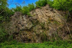 Geological Outcrop with Cretaceous Rock layers photo