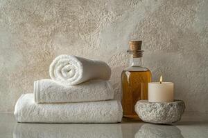 Minimalist still life of luxury spa essentials. White cotton towels with visible textured . photo