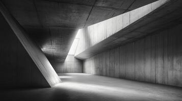 A modern concrete room with sloped walls and indirect ceiling light in an industrial interior design setting photo