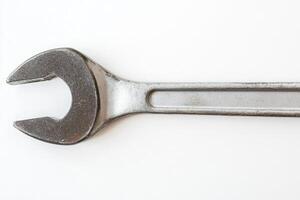 Top view of a ratcheting wrench isolated on white background highlighting its essential role in mechanical tasks photo