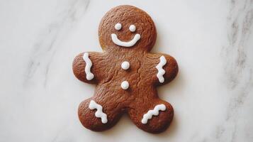 A cheerful gingerbread man cookie decorated with icing sits against a clean white background, perfect for holiday festivities and baking traditions photo