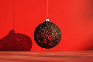 A minimalistic Christmas ball silhouette design with thin lines against a vibrant red background for festive decor photo