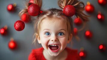 A joyful child with playful expressions and red ornamented pigtails brings cheer during a festive season photo