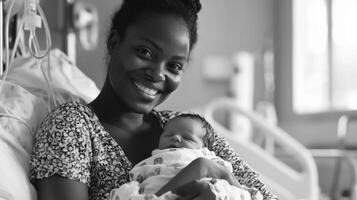 Mother joyfully holds her newborn baby in a hospital room on the day of birth, radiating happiness and love photo