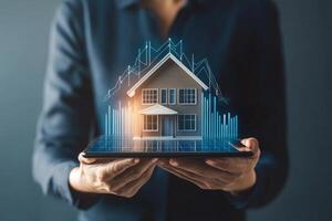 Businessman showcasing a digital house model and rising graphs to illustrate real estate investment trends in a modern office setting photo