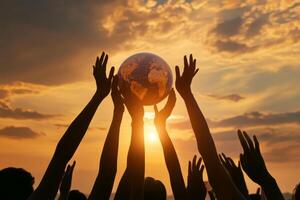 Diverse hands lift a globe against a breathtaking sunset sky, embodying global unity and hope for a better future photo