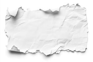 A crumpled piece of white paper with a ripped edge resting on a plain background, suggesting an unfinished message or idea photo