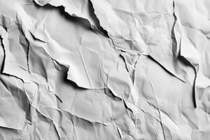 Torn note on crumpled white paper background, showcasing the texture and imperfections of aged stationery photo