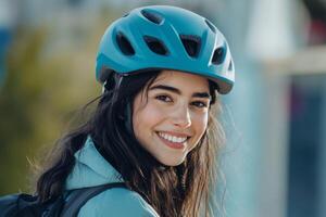 Joyful young woman smiles while putting on her bicycle helmet before cycling outdoors in urban surroundings photo