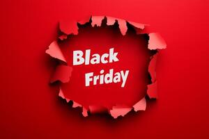 Exciting Black Friday sale announcement with a torn paper effect on a vibrant red background to attract shoppers in November photo