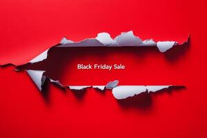 Exciting Black Friday sale announcement with a torn paper effect on a bold red background, perfect for holiday shopping promotions photo