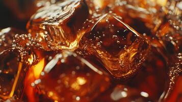Close-up view of ice cubes resting in fizzy cola, showcasing bubbles and textures of a refreshing cold drink photo