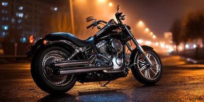 Nighttime motorcycle parked on a wet street illuminated by streetlights with a vibrant urban backdrop photo