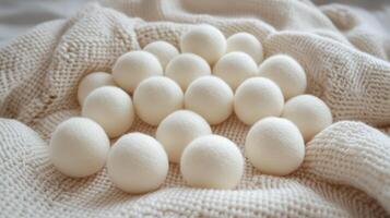 Wool dryer balls arranged on a soft, textured fabric in a cozy indoor setting photo