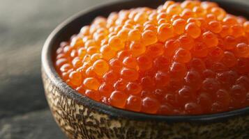 Fresh salmon roe served in a rustic bowl highlighting vibrant color and texture from a recent seafood market visit photo