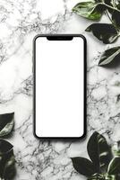 Elegant smartphone positioned on marble surface surrounded by lush green leaves in a tranquil setting photo