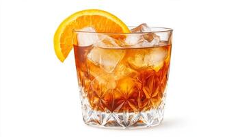 Refreshing orange cocktail garnished with a slice of fruit served in a crystal glass filled with ice photo