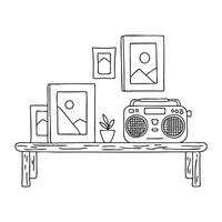 A tape recorder beside photo frames on a coffee table vector