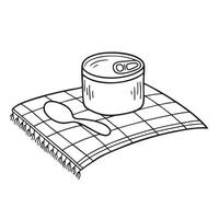 A tin resting beside a spoon on a picnic table vector