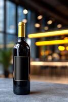 Red wine bottle on a table, blurred modern interior background photo