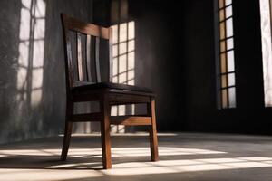 A chair in front of a window with sunlight photo