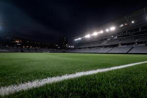 A soccer field at night with lights on photo