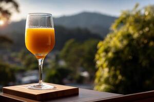 Orange juice in a glass, mountain view photo