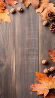 Autumn leaves border brown wooden background. Fall season acorns and pine cones on aged wood panels. Top view arrangement with copy space. photo