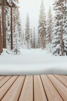 Wooden planks overlook snow covered ground and trees. Forest scene with tall trees coated in snow. Winter scene shows a white landscape. photo
