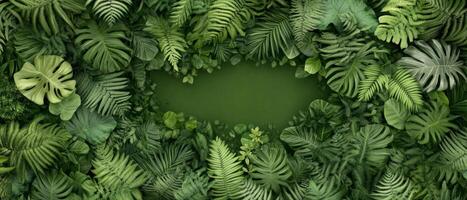 Vibrant tropical foliage in various shades of green surrounds a tranquil pond in the heart of a lush jungle, showcasing nature's beauty and diversity photo