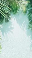 Lush palm leaves create a vibrant frame around clear turquoise water, reflecting the sunlight beautifully in a tranquil tropical setting photo