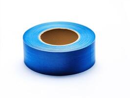 Bright blue tape roll on a plain background for crafting projects photo