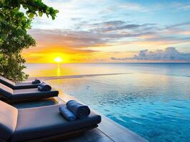 Sunset view over tranquil infinity pool by the ocean photo