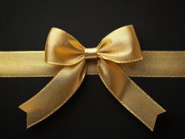 Elegant gold bow on a dark background for special occasions photo
