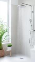 Water flows from shower head in bright modern bathroom. Plant stands near window. Refreshing cascade of water creates relaxing scene. photo