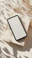 Smartphone Mockup on Books with Dried Flowers photo