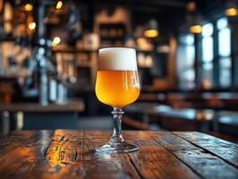 Craft beer served in a glass on a rustic wooden table photo