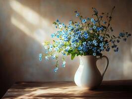 Beautiful blue flowers in a white pitcher on a wooden table photo