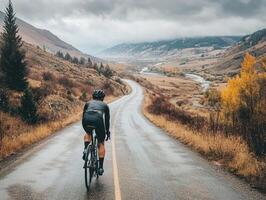 Cyclist rides through scenic countryside on a cloudy day photo