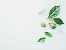 Creative arrangement of fresh green leaves and powders photo