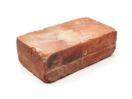 Brick lying on a flat surface in natural light photo