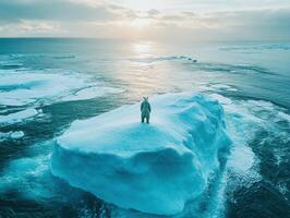 Polar bear standing on an ice floe during sunset near the Arctic Ocean photo
