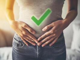 Health check on digestion with hands on stomach in cozy setting photo