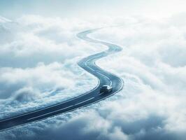 Winding road disappearing into the clouds at dawn photo