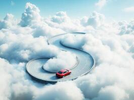 Winding road through clouds with red car in the sky photo
