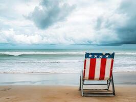 Beach chair facing ocean with cloudy sky in the background photo