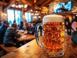 Enjoying beer in a cozy mountain lodge during winter evening photo