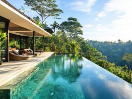 Luxurious villa with infinity pool overlooking lush jungle photo