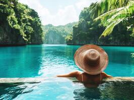 Relaxing by the turquoise lagoon with lush mountains surrounding photo