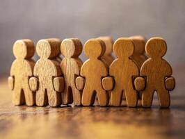 Wooden figures symbolizing teamwork in a group photo